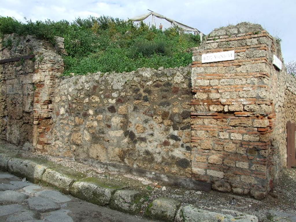V.6.1 Pompeii. December 2006. Photo showing entrance to shop.  The pillar on the right used to have a painting of Bacchus.  The pillar on the left used to have a painting of Mercury.  See Frhlich, T., 1991, Lararien und Fassadenbilder in den Vesuvstdten.  Mainz: von Zabern.  (F34: p.318).  According to Garcia y Garcia, the loss of these paintings was attributable to the bomb that fell in the road here on the night of 16 September 1943. The paintings were photographed at the time of Sogliano, around 1906, and also by Tatiana Warscher, pre 1943. 
These can be seen in Garcia y Garcia, L., 2006. Danni di guerra a Pompei. Rome: LErma di Bretschneider. (p. 66).
