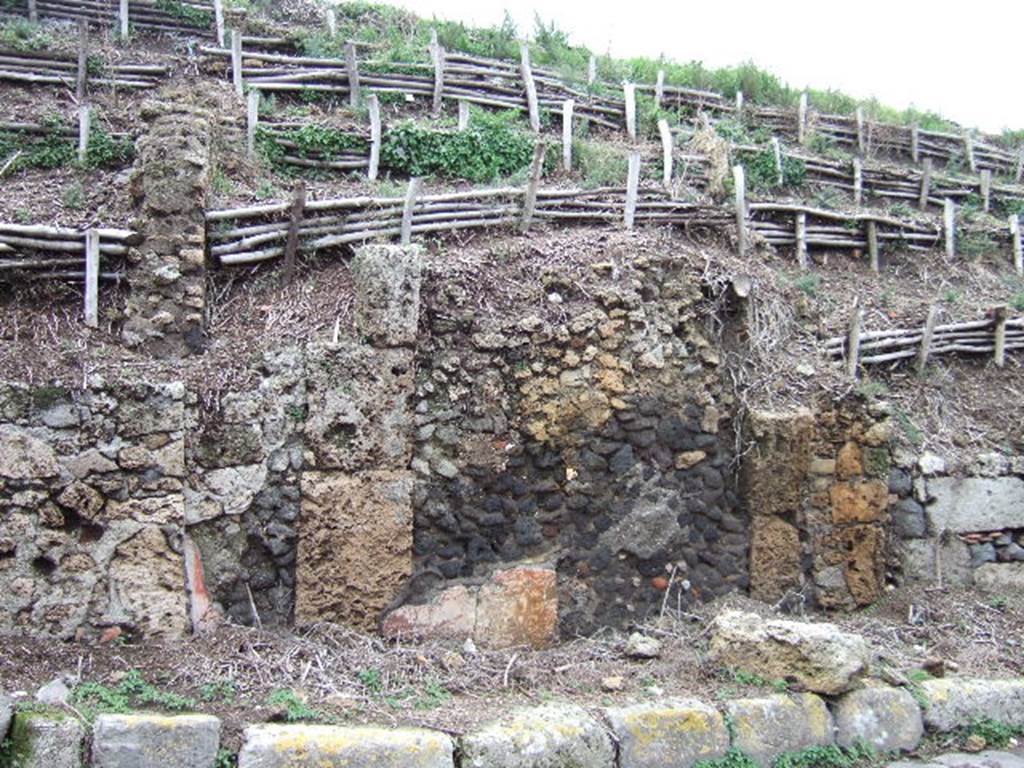 V.6.12 Pompeii. December 2005. Details of façade on north side of entrance doorway, on right.              