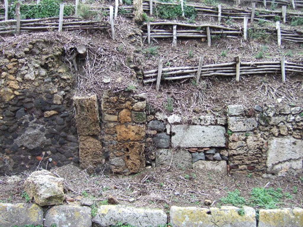 V.6.12 Pompeii. December 2005. V.6.12 entrance is centre right with the wide horizontal rectangular stone. 
