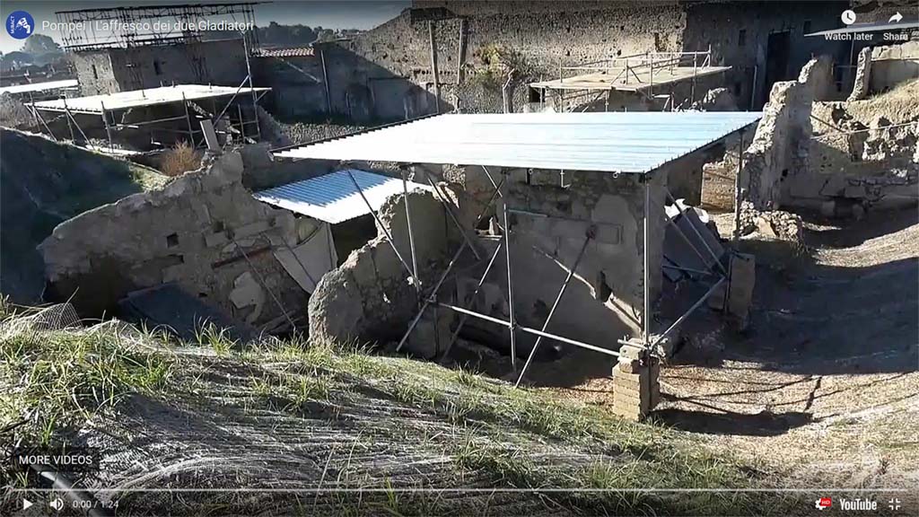 Area behind the widening of the intersection of the Vicolo dei Balconi and the Vicolo delle Nozze D’Argento.
The bar is centre front in this photo which would appear to locate it in the as yet unnamed insula behind V.3 (=V.8?). 
See MiBAC video of Gladiatori Combattenti on YouTube: https://youtu.be/sqq__TTvu5g
Photograph and video courtesy of MiBAC. Use subject to Creative Commons - Attribuzione - versione 3.0.
See commentary by Minister Dario Franceschini on YouTube: https://youtu.be/NvmRXTWRuYw
