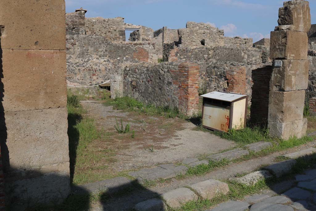 VI.1.14, Pompeii. December 2018.
Looking east to entrance doorway, numbered on plaque as VI.1.15. Photo courtesy of Aude Durand.