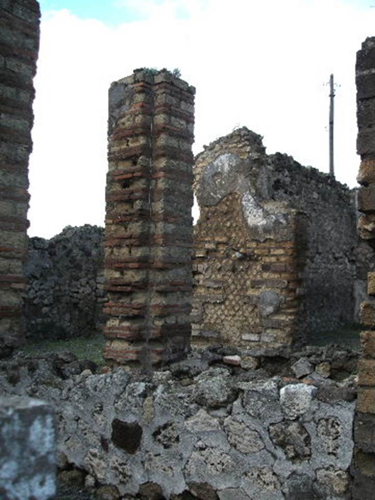 VI.3.21 Pompeii. December 2004. Looking north from entrance doorway.
According to Jashemski, she said that Fiorelli thought that the area to the north of the entrance was a small garden. Two pillars supported the roof, leaving a narrow area open for cultivation. See Jashemski, W. F., 1993. The Gardens of Pompeii, Volume II: Appendices. New York: Caratzas. (p.124)
