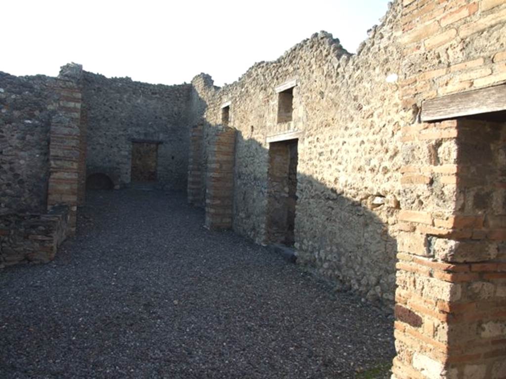 VI.7.15 Pompeii. December 2007. Looking west across yard, on the north side (right) were doorways to four small rooms.