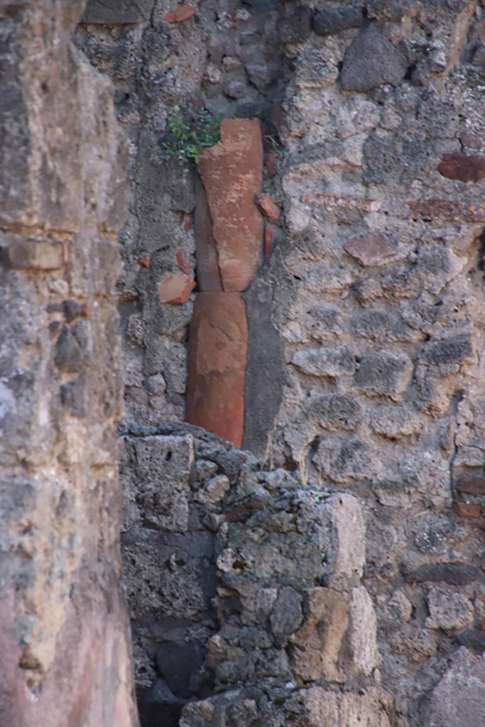 VI.7.16 Pompeii. October 2022.
Downpipe in west wall of room in south-west corner. Photo courtesy of Klaus Heese.
