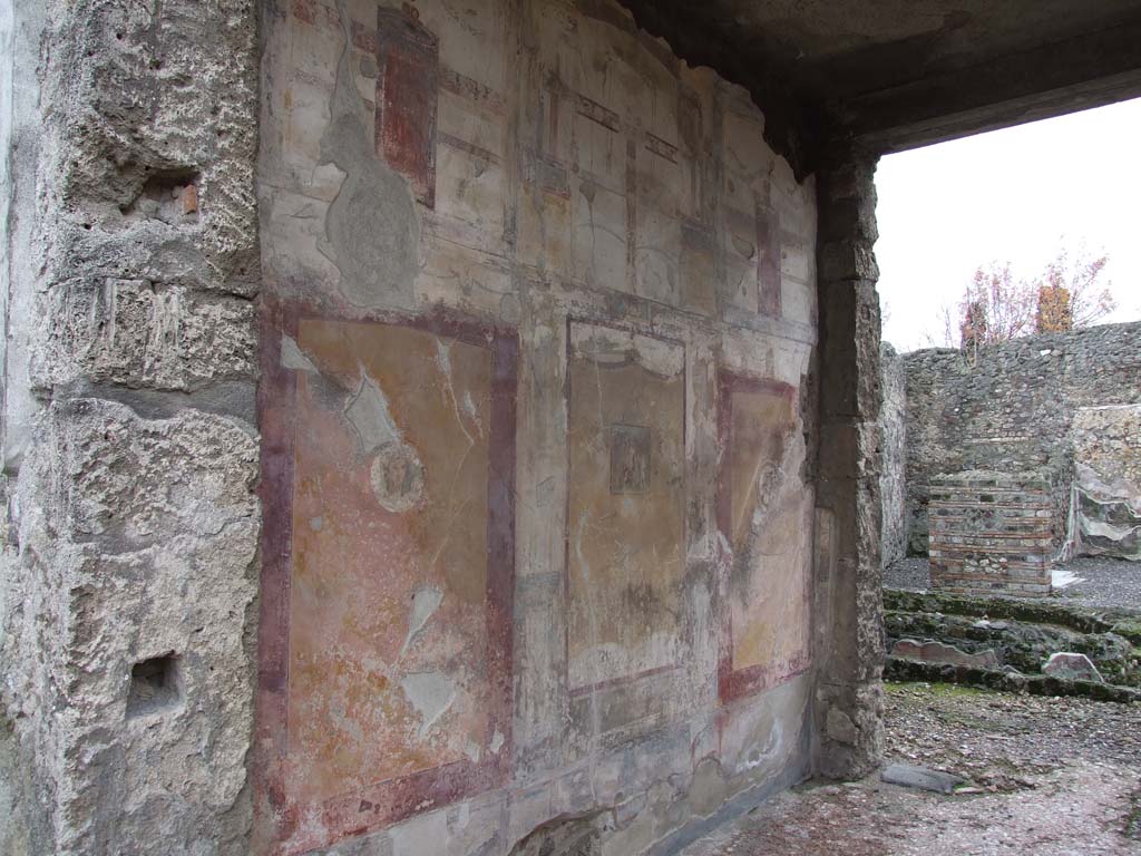 VI.7.23 Pompeii. December 2006. South wall of tablinum, looking west towards remains of fountain in courtyard.