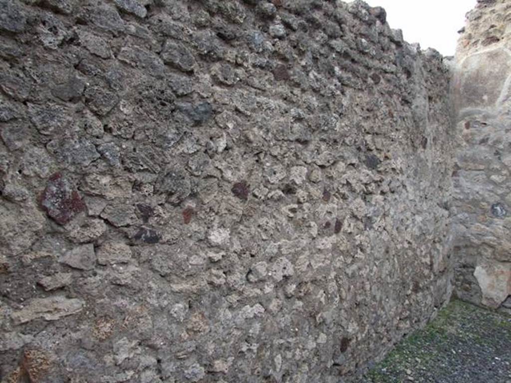VI.8.11 Pompeii.  Shop.  December 2007.  West wall of rear room. 