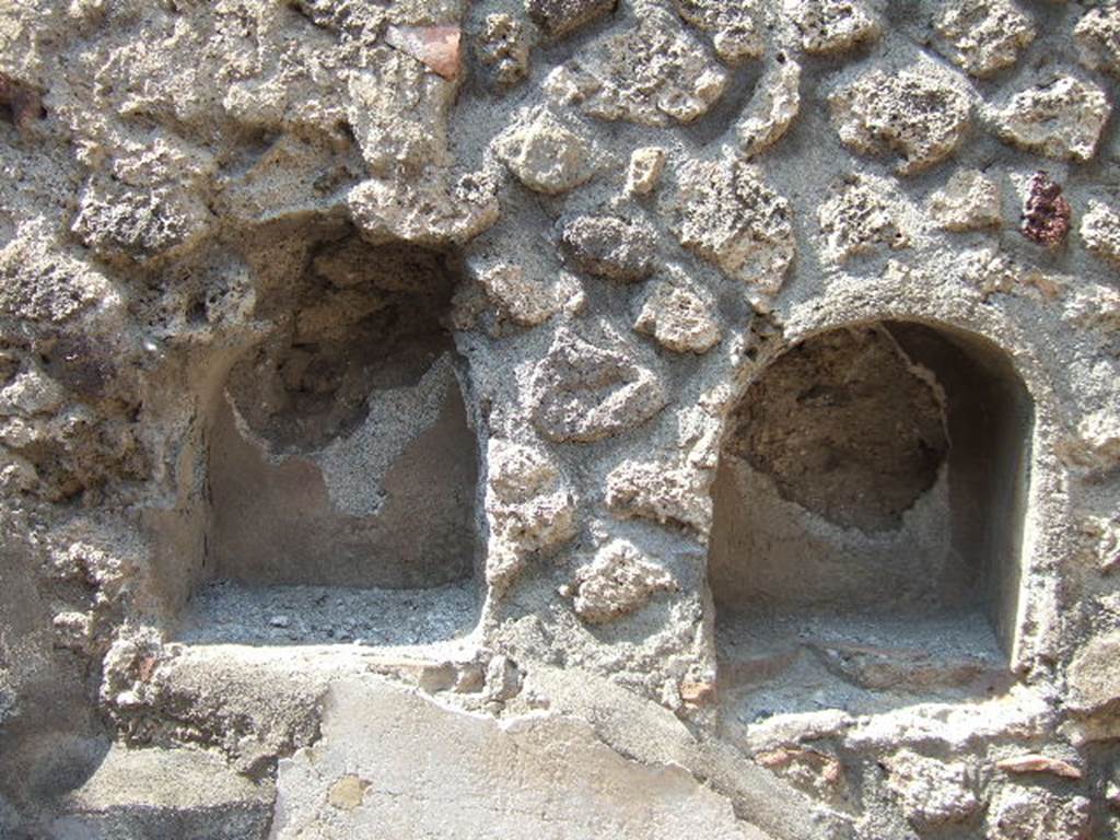 VI.8.14 May 2006. Two niches on north wall.