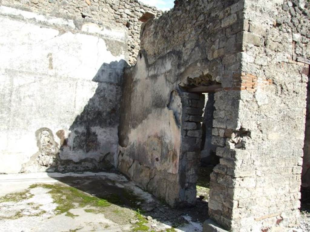 VI.8.20 Pompeii. March 2009. Room 6, east wall (left) and south wall with doorway to room 7.
According to PPM –
“On the east wall, now however, no longer visible, a painting was interpreted as Admetus (PAH II, p.162) or better, as Arianna abandoned (Helbig 223).
(Note: PAH II, p.162 – 
“……….. three paintings, in one of which was seen (a new thing) Theseus who had killed the Minotaur; in another on the facing wall, Adonis sitting injured, Venus and a Cupid; and finally in the third, which was on the wall (east wall), it seemed to me that I could see Admetus with the base of a landscape, Naples 3rd June 1826.”)
According to Helbig (223) –
“This was identified by Fiorelli as Admetus, I find this explanation unfounded, the painting was probably identical to 1216 – “Theseus seated with Arianna speaking to him, bemoaning her lot.”
