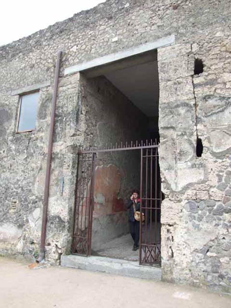 VI.8.23 Pompeii. May 2010. Entrance, with painted plaster on south wall of the entrance corridor.
