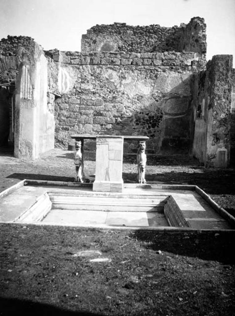 VI.9.2 Pompeii. W.449. Room 2, looking east across impluvium 3 in atrium, towards tablinum 8.
At the far end of the impluvium are podium 5 table legs 4 and 6 and the marble table top.
Photo by Tatiana Warscher. Photo © Deutsches Archäologisches Institut, Abteilung Rom, Arkiv. 
