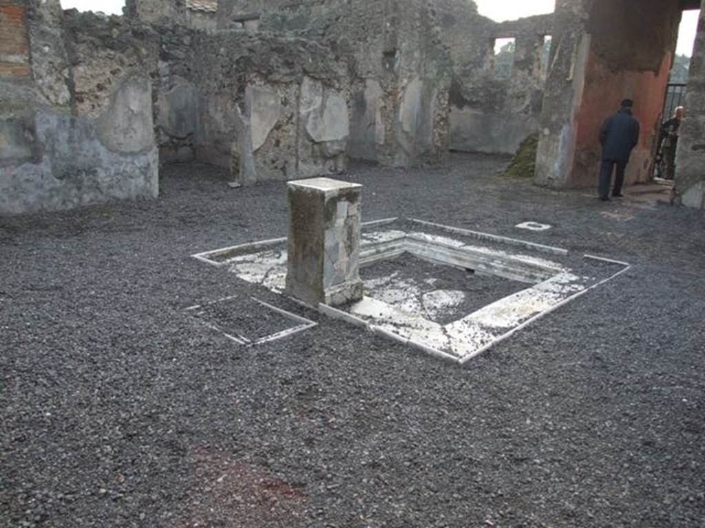 VI.9.2 Pompeii. December 2007. Room 2, atrium, impluvium 3 and pedestal 5, looking south-west towards room 10. In the left foreground behind pediment 5 and originally under the table 6 are two square marble recesses 7. According to Overbeck and Mau these were for cooling bottles. See Overbeck J., 1884. Pompeji in seinen Gebuden, Alterthmen und Kunstwerken. Leipzig: Engelmann, p. 308.