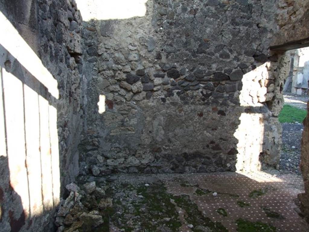 VI.9.4 Pompeii. December 2007. Looking east from entrance into room 15.  
According to Fiorelli, this was a room with a staircase to the upper floor and a separate entrance doorway to the Via. He also said that at some time a servant name Paris wrote his graffito for posterity –
Paris hic
fuit
See Pappalardo, U., 2001. La Descrizione di Pompei per Giuseppe Fiorelli (1875). Napoli: Massa Editore. (p.65) 

Paris was here. (CIL IV 1305)
See Berry, J., 2007. The Complete Pompeii. London: Thames & Hudson. (p.103)
