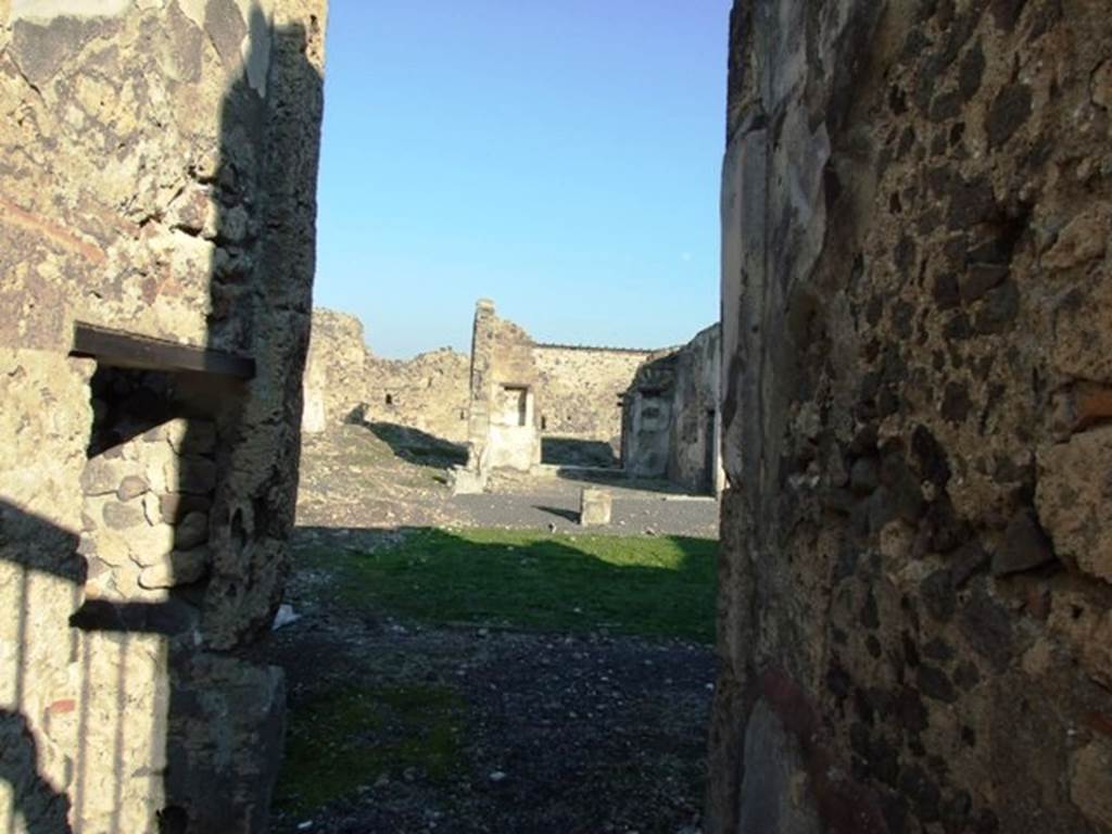 VI.9.5 Pompeii. December 2007. Looking across Corinthian atrium 16  to tablinum 26. According to Jashemski, the atrium was enclosed with sixteen white columns. In place of an impluvium there was a viridarium with a small pool in the centre. See Jashemski, W. F., 1993. The Gardens of Pompeii, Volume II: Appendices. New York: Caratzas
