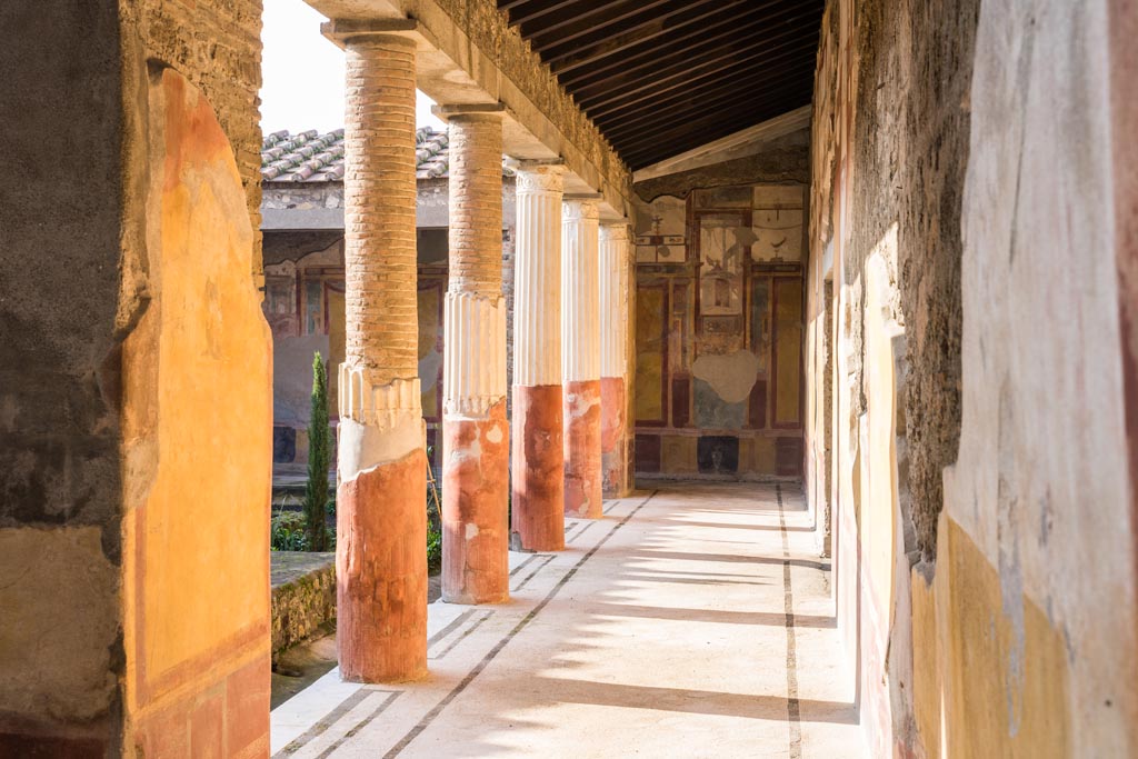 VI.9.6 Pompeii. January 2023.
Room 6, looking west along north wall towards north-west corner of peristyle. Photo courtesy of Johannes Eber.