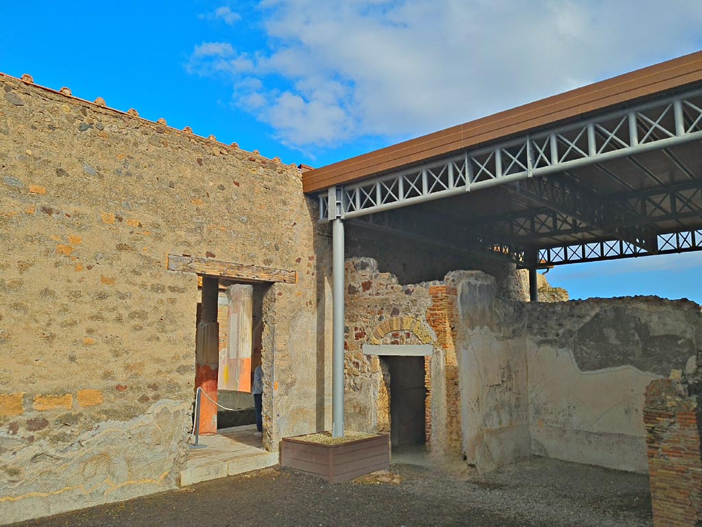 VI.9.7 Pompeii. November 2023. 
Room 2, looking north-east across atrium towards doorway to atrium of VI.9.6, centre left, and room 9, cubiculum, and 10, tablinum, on right. 
Photo courtesy of Giuseppe Ciaramella.
