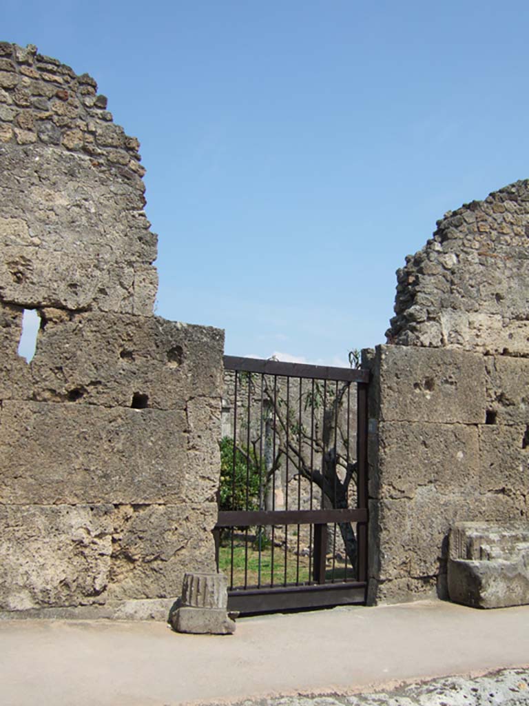VI.10.8 Pompeii. May 2006. Rear garden entrance of Casa del Naviglio.
According to Pagano and Prisciandaro, found in August 1826, painted in red, on the external wall between VI.10.7 & 8 (on the left) was

N(umerium) Barcham IIV(irum) v(irum) b(onum) o(ro) v(os) f(aciatis) ita v(obeis) Venus Pomp(eiana) sacra (sancta propitia sit)    [CIL IV 26]

In January 1827 found on the wall on the left of this doorway, between doorway VI.10.7 and 8, were –

[3]rium Sabinum
aed(ilem) Melissaeus et Tintirius
optimum iuvenum rog(ant)    [CIL IV 158]

M(arcum) Cerrinium aed(ilem)
[3] Sucula rog(at)
d(ignum) r(ei) p(ublicae) s()    [CIL IV 159]

On the same wall, painted in red, were found –

Marcellum
aed(ilem) rog(at)    [CIL IV 160]

M(arcum) Holconium
Priscum aed(ilem) o(ro) v(os) f(aciatis)     [CIL V 161]

L(ucium) Varium [M]<G=C>allica[nun]
[6]
aed(ilem) d(ignum) r(ei) p(ublicae) o(ro) v(os) f(aciatis)    [CIL IV 162]

Also painted in red, were –

Casellium
aed(ilem) o(ro) v(os) f(aciatis)    [CIL IV 163]

M(arcum) C(errinium V(atiam) aed(ilem)
Memor rog(at)    [CIL IV 164]

C() Pulnis feliciter    [CIL IV 165]

See Pagano, M. and Prisciandaro, R., 2006. Studio sulle provenienze degli oggetti rinvenuti negli scavi borbonici del regno di Napoli. Naples: Nicola Longobardi, p.136.   

