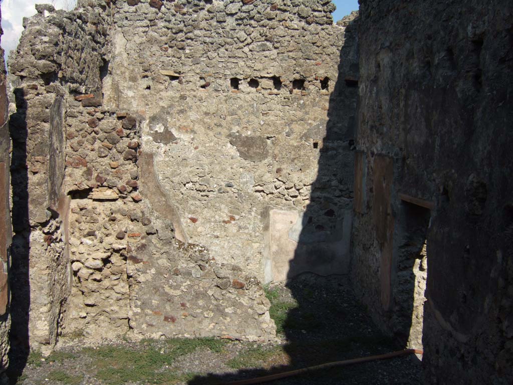 VI.11.8 Pompeii. September 2005. Looking east across room 56 to room 49, with doorway to bakery 16. 