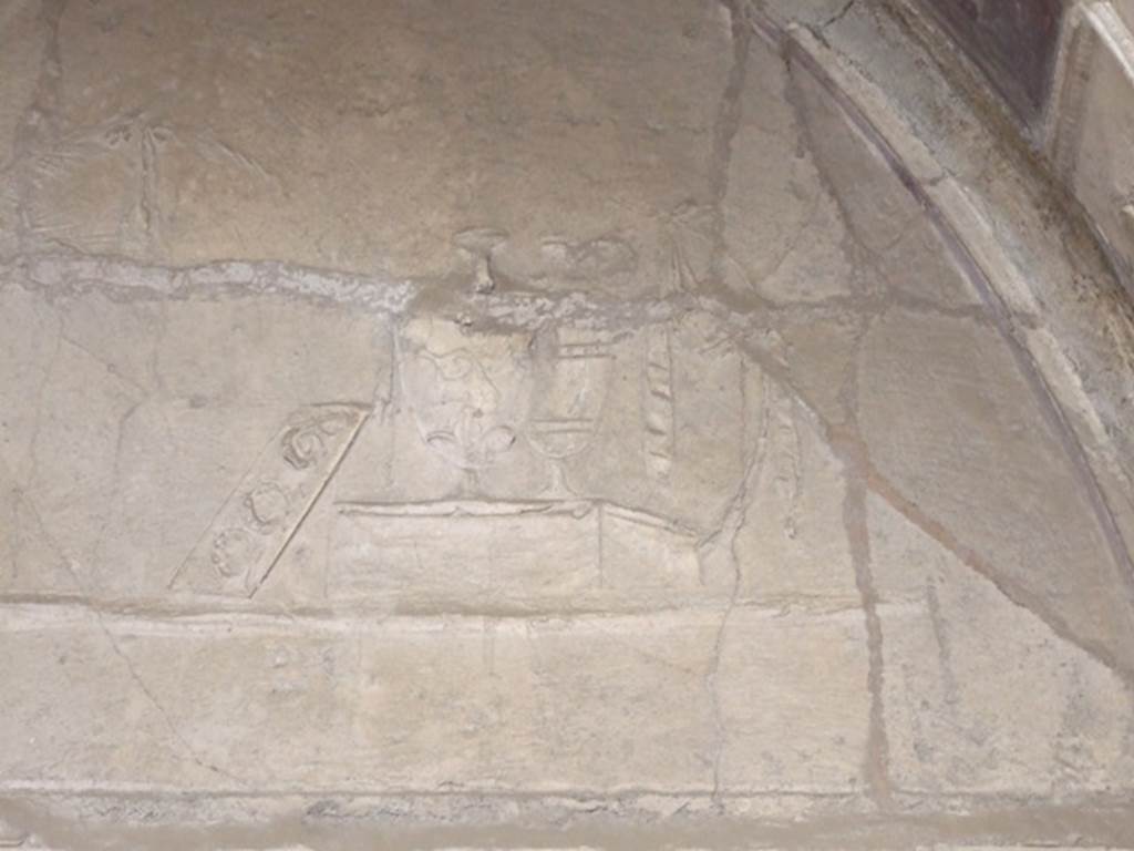 VI.11.9 Pompeii. Room 21, detail of stucco on east wall at south end.