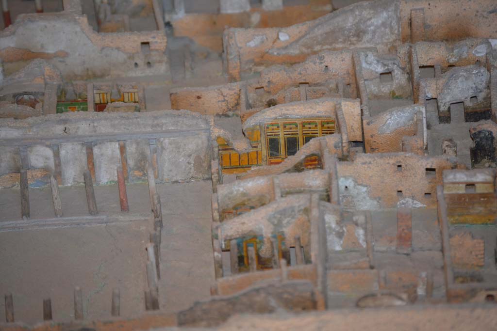 VI.11.9/10 Pompeii. July 2017. Peristyle 36, looking towards west portico at north end.
Across the centre on the left, the west wall of the bath rooms 22, 21 and 20 can be seen, followed by the doorway from the bakery into Vicolo del Fauno.
In the centre, the painted yellow/black wall of room 39 can be seen.
From cork model in Naples Archaeological Museum.
Foto Annette Haug, ERC Grant 681269 DÉCOR.