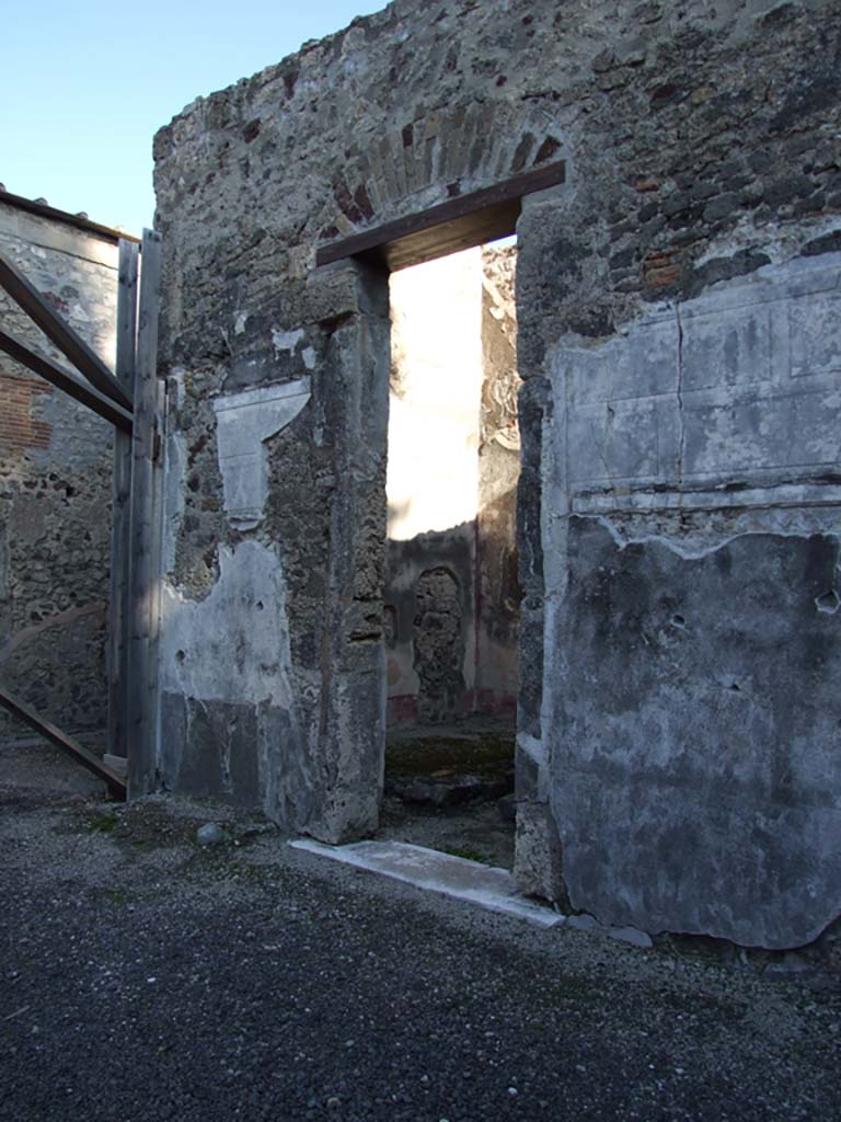 VI.11.10 Pompeii. December 2007. 
Looking north along east side of atrium with doorway to room 30, in centre.  
