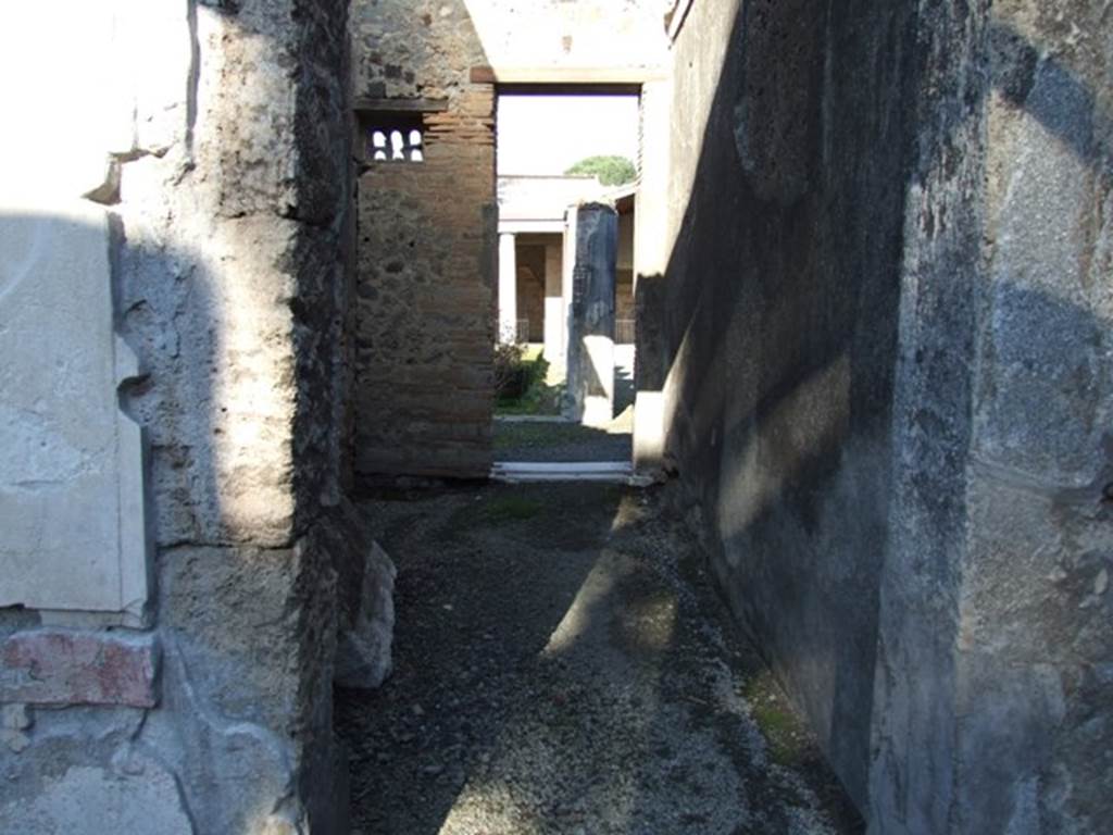 VI.11.10 Pompeii. December 2007. Room 34, room or corridor leading north from atrium to peristyle.
In the north-west corner can be seen a small window, which was closed by a plaque of terracotta pierced by six small arched openings.
They resembled the entrances into a dove-cote. Many of this type had been found at Pompeii.
See Breton, Ernest. 1870. Pompeia, Guide de visite a Pompei, 3rd ed. Paris, Guerin.