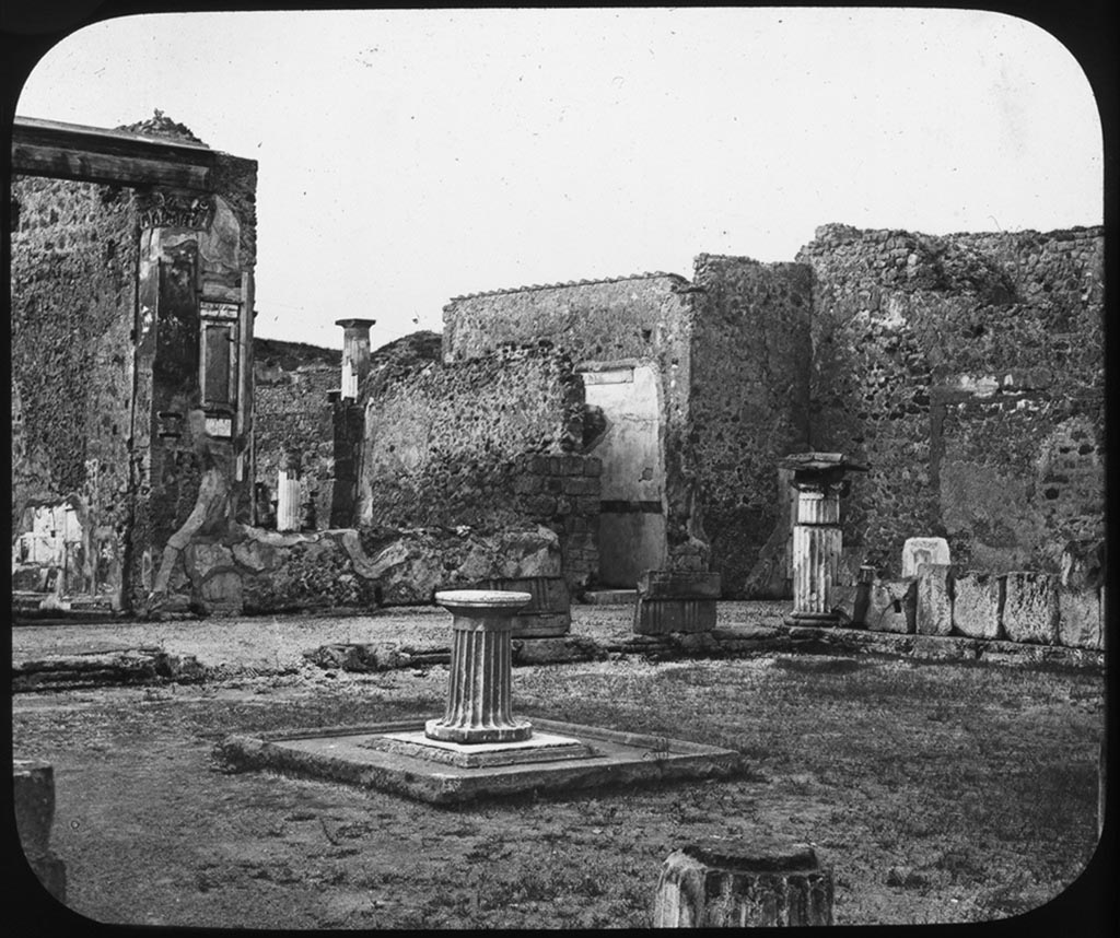 VI.12.2 Pompeii. 7th August 1976. Looking south-west across west exterior wall of middle peristyle and towards one of two dining rooms (on left).
Photo courtesy of Rick Bauer, from Dr George Fay’s slides collection.

