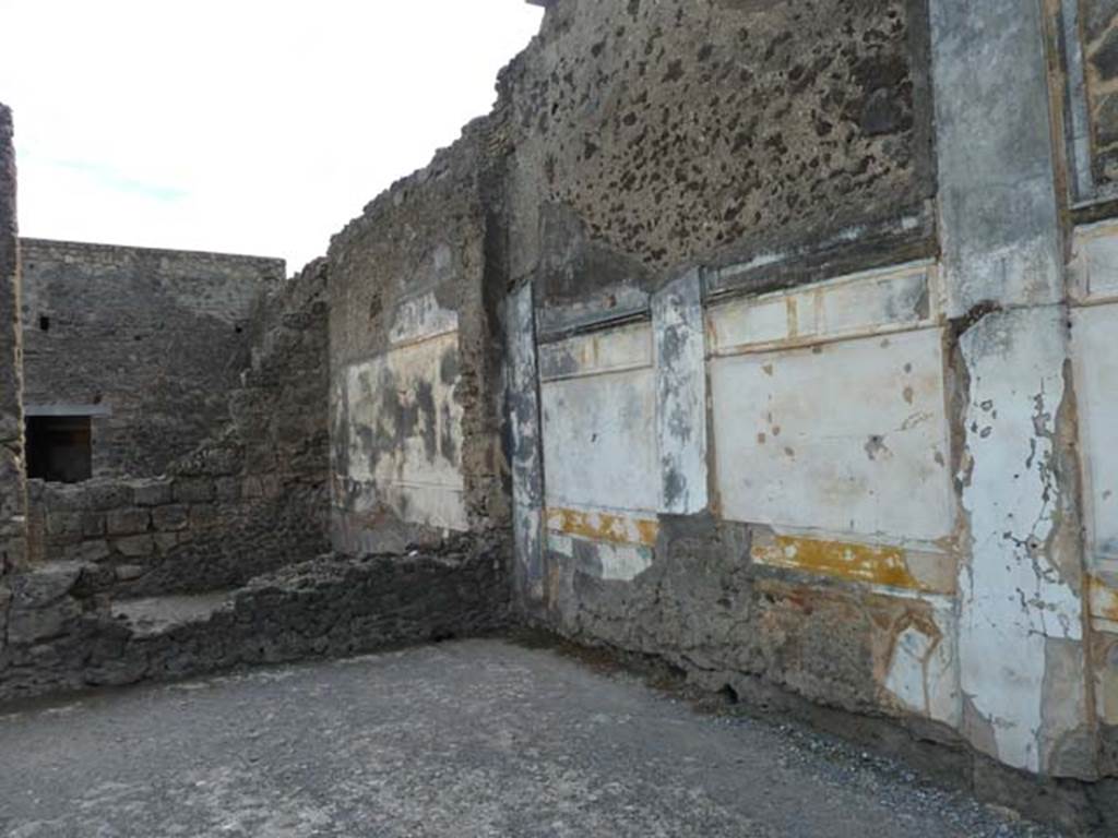 VI.12.2 Pompeii. September 2015. 
Looking south-west across middle peristyle, towards one of two dining rooms, and ala with doorway from cubiculum on west side of atrium.
According to Fiorelli, in this dining room on the left of the tablinum, which gave access through to the peristyle, a mosaic of Bacchus on a panther was found. 
See Pappalardo, U., 2001. La Descrizione di Pompei per Giuseppe Fiorelli (1875). Napoli: Massa Editore, (p.71).
(Note: However, according to the information noticeboard from Naples Museum, the mosaic emblema with fishes was found in the room on the left of the tablinum.)

