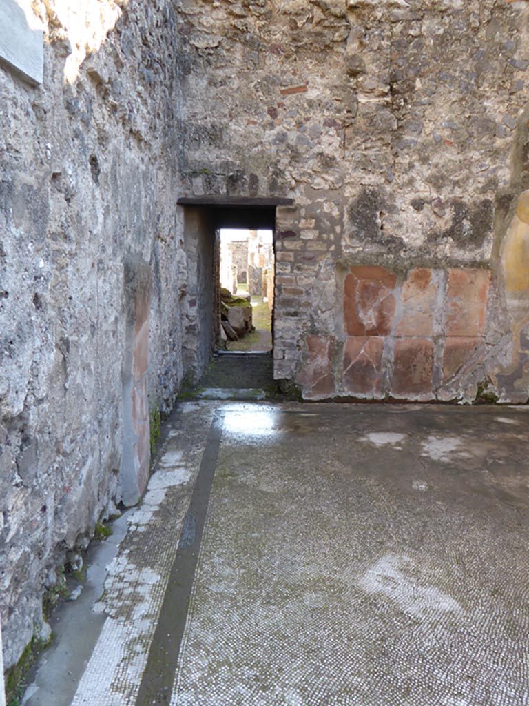 VI.12.2 Pompeii. March 2009. 
East wall, left, with doorway to oecus, previously a caldarium, in south-east corner of second or rear peristyle.
