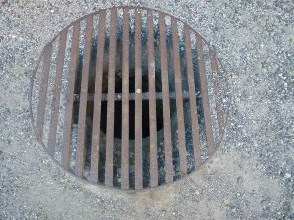 VI.12.6 Pompeii. June 2012. Cistern mouth in floor of shop. Photo courtesy of Michael Binns.