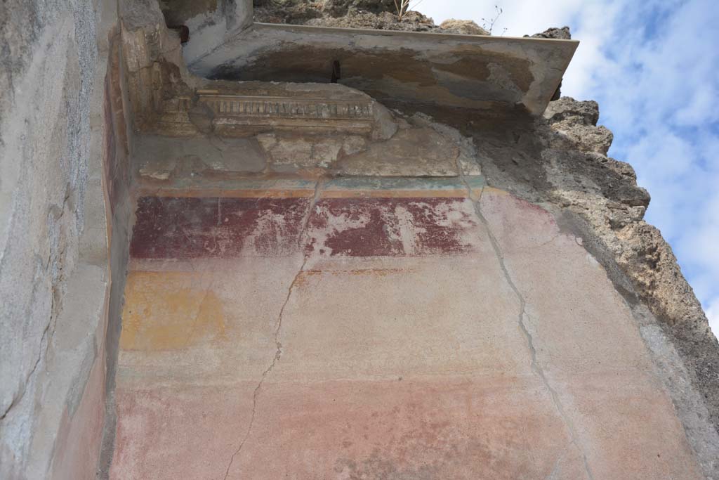 VI.14.12 Pompeii. July 2017. Detail of remaining painted stucco from west wall in south-west corner of atrium.
Foto Annette Haug, ERC Grant 681269 DÉCOR.
According to PPM –
“In the south-west corner of the atrium, the decoration remained in I Style only above the doorway to VI.14.13 in the south wall.
On the west wall of the atrium it had been restored in III Style, with the middle zone of the wall painted red, a yellow frieze and violet with remains of a human figure.”
See Carratelli, G. P., 1990-2003. Pompei: Pitture e Mosaici. V (5). Roma: Istituto della enciclopedia italiana, (No. 5, p.250-251).