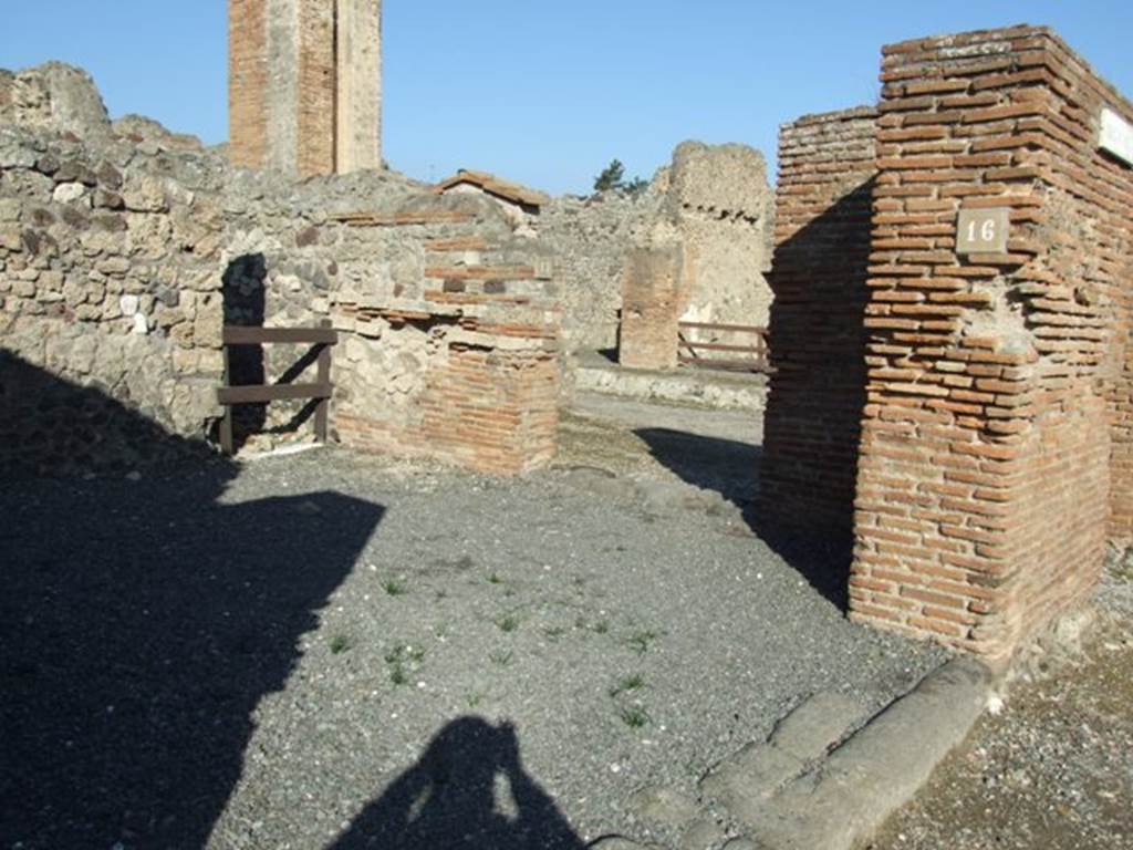 VI.14.16 Pompeii, entrance doorway on Via della Fortuna, on the left, with VI.14.17 doorway on Via del Vesuvio in background. December 2007. According to Della Corte, on the front of the street, a recommendation was found towards the south-east corner of insula VI.14. He could not say exactly where it was found, but it was written by a society of tavern-keepers in support of the candidate Sallustius Capito. It read - Caupones facite    [CIL IV 336]
See Della Corte, M., 1965.  Case ed Abitanti di Pompei. Napoli: Fausto Fiorentino. (p.121)
According to Epigraphik-Datenbank Clauss/Slaby (See www.manfredclauss.de), it read 
Sallustium Capitonem aed(ilem)
o(ro) v(os) f(aciatis) caupones facite       [CIL IV 336]
On the extreme right of the photo, at the end of the brick pilaster, another entrance can be seen. This was the entrance at the south end of the portico on the west side of Via del Vesuvio, and as such was numbered as Strada della Fortuna 28. 
