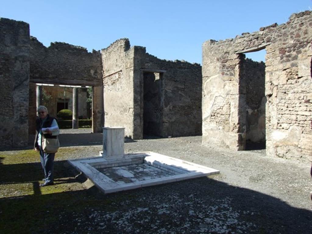 VI.14.20 Pompeii. March 2009. Room 1, looking north-west across atrium, towards doorways to rooms 5, 6 and 7, from room 2.