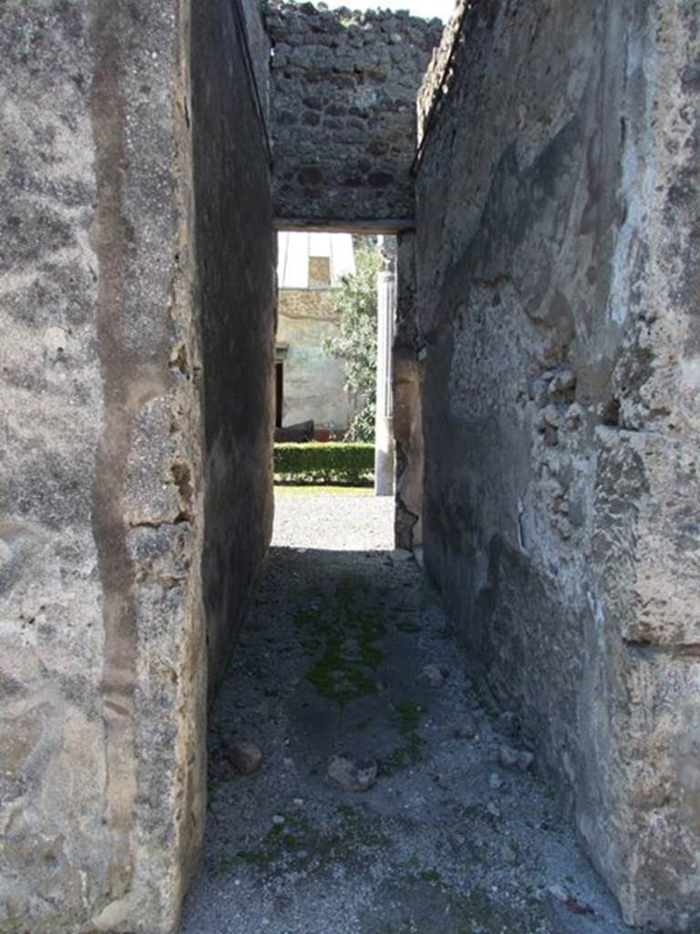 VI.14.20 Pompeii. March 2009. Room 5, looking west along corridor leading to rear. Within the corridor on the right at the far end is a doorway leading to room 10.