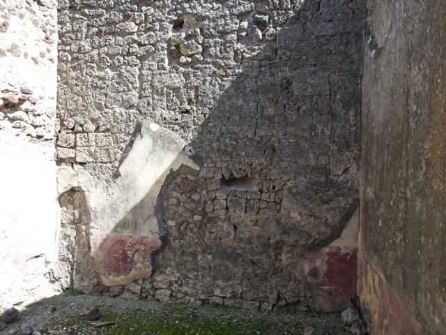 VI.14.20 Pompeii. March 2009. Room 10, 2 niches (filled in) on east wall of triclinium.  