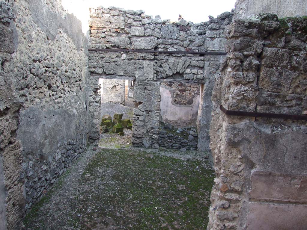 VI.14.22 Pompeii. December 2007. Looking east from raised level into room 5 and through doorway into atrium.