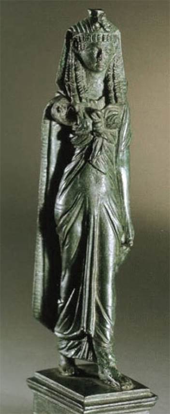 VI.14.27 Pompeii. Found in room “b”.
Bronze statuette of Isis.
Now in Naples Archaeological Museum. Inventory number 110605?
