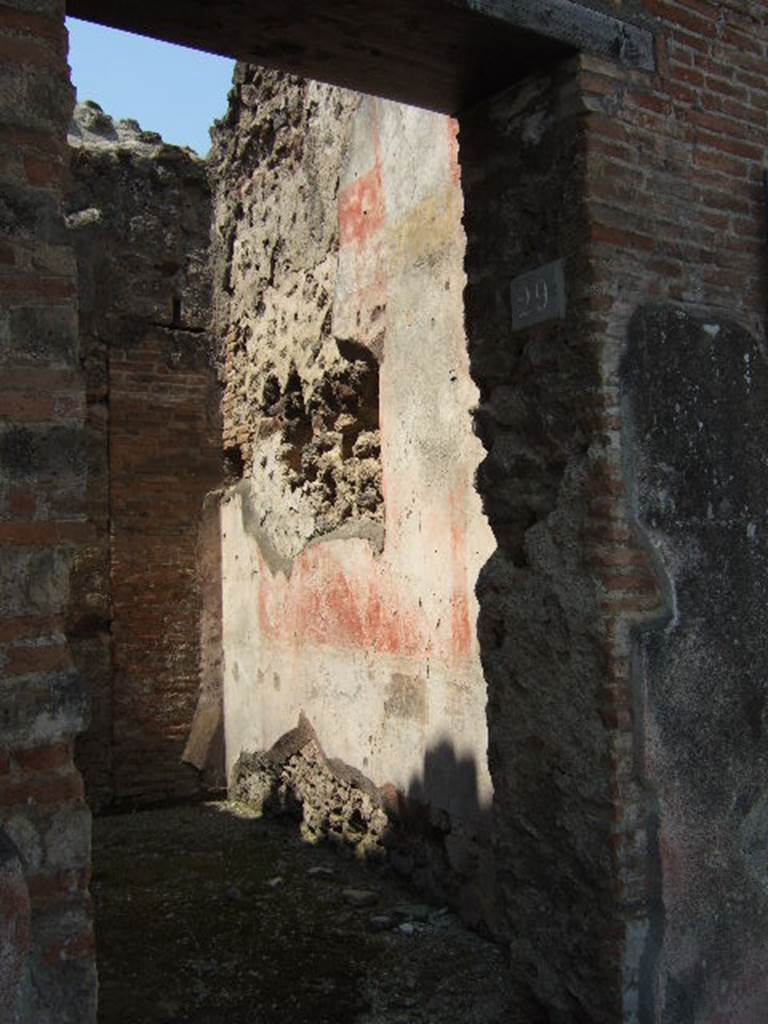 VI.14.29 Pompeii. May 2006. North wall. According to Della Corte, the room of the stairs at VI.14.29 which had originally been a cubiculum of the House of the Laocoonte, was decorated with Style III paintings. These have only been preserved in part on the north wall. In the centre of the north wall was found the picture of a man and a woman on a bed, in front of which is a table with drinks: a servant stands nearby. The painting is now in the Naples Archaeological Museum. Inventory number 111209.  Sogliano described it (Sog.641 on p. 131). (Bull.Inst 1876, p.51, and Giorn.Scav.Pomp, n.s. III, p.147).
Another painting, Sogliano S.649, described a female figure lying on a bed. According to Sogliano this was found in the room to the left of the entrance of VI.14.28 (Bull.Inst 1876, p.51), but no decoration has survived. Della Corte thought it may have been from the corresponding room on the upper floor, as did Mau (B.I., 1876, p.49). This painting may have been in the cella meretricia, whose location was unknown.
See Della Corte, M., 1965.  Case ed Abitanti di Pompei. Napoli: Fausto Fiorentino. (p.94)  See Sogliano, A., 1879. Le pitture murali campane scoverte negli anni 1867-79. Napoli: (p. 131 and p. 133)

