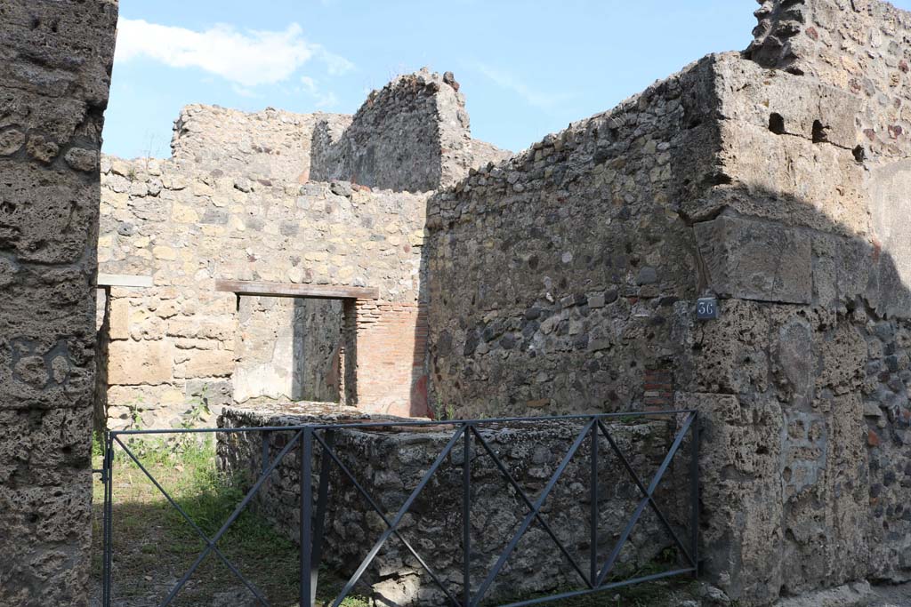 VI.14.36 Pompeii. December 2018.
Looking south-east to entrance doorway on east side of Vicolo dei Vettii. Photo courtesy of Aude Durand.