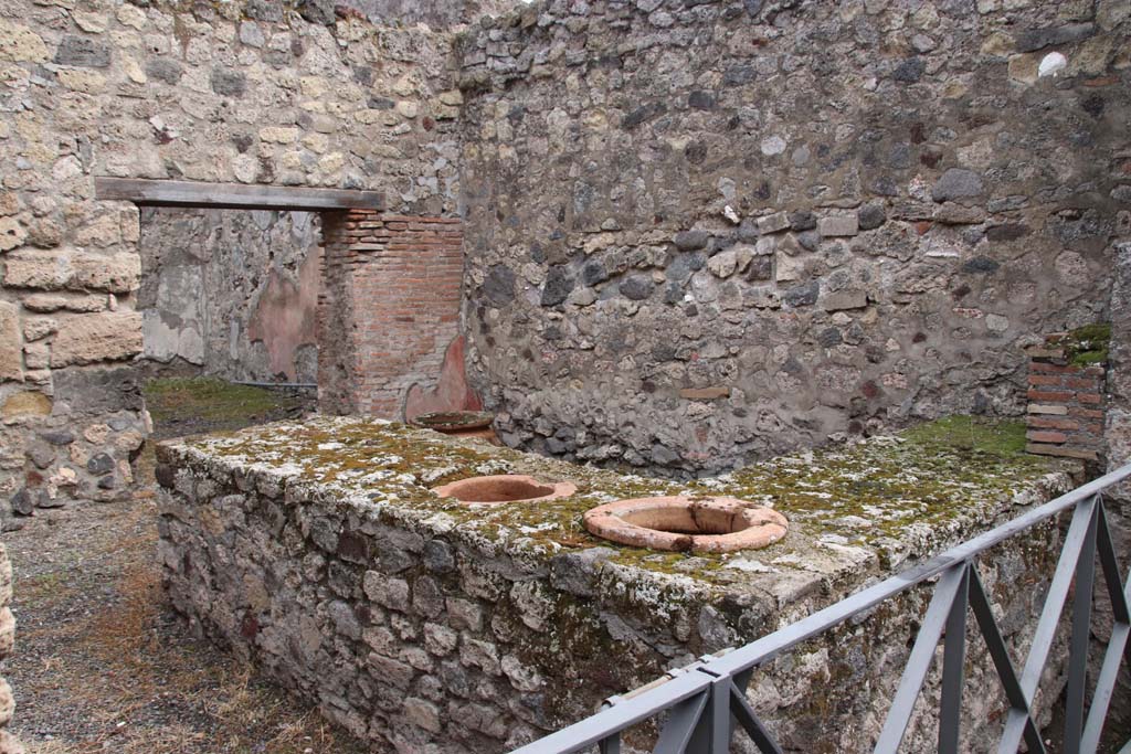 VI.14.36 Pompeii. October 2020. Looking east across two-sided counter with two dolia set in it. Photo courtesy of Klaus Heese.