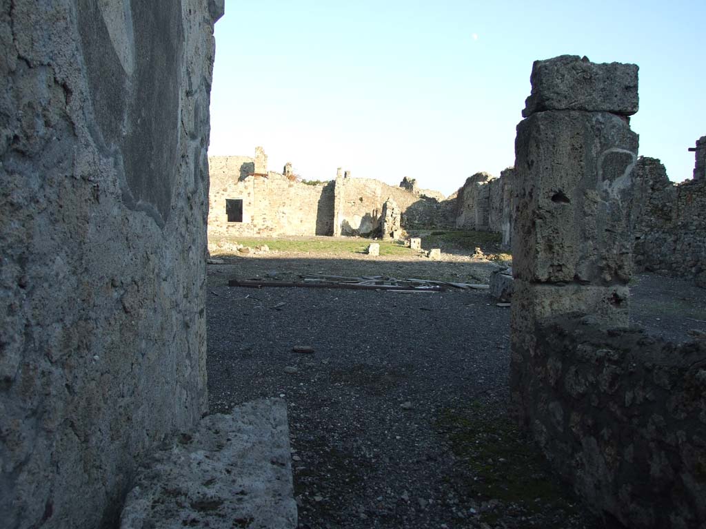 VI.14.38 Pompeii. December 2007. Looking east across atrium, tablinum and peristyle, from entrance doorway.
According to Garcia y Garcia, this house was badly hit by the 1943 bombing.
It caused the destruction of the atrium floor, including the impluvium and the marble table.
Also destroyed were the two rooms nearby on the north side of the atrium with their decoration, the south wall of the peristyle and the loss of the IV Style painted plaster in two rooms adjacent to the north-east of this.
The stucco of four of the columns in the peristyle also collapsed.
Today the house still appears a complete ruin.
See Garcia y Garcia, L., 2006. Danni di guerra a Pompei. Rome: L’Erma di Bretschneider. (p.91-93, incl. photos).