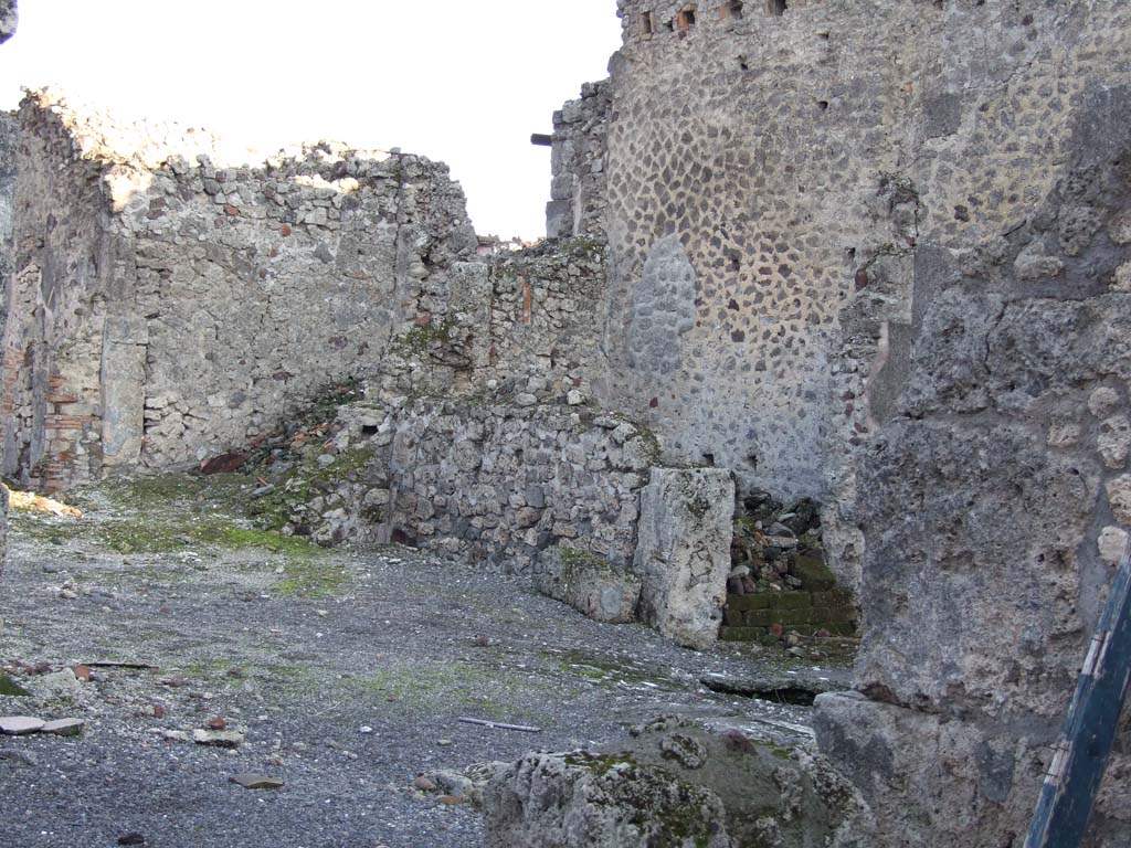 VI.14.39 Pompeii. December 2007. 
Looking south-east across area of atrium and tablinum, towards doorway to small room “e” on south side of tablinum. 
According to NdS, this room “e” was a cubiculum.
