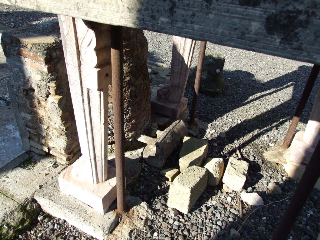 VI.14.43 Pompeii. December 2007.  Room 1, remains of lead pipe and valve behind impluvium in atrium.