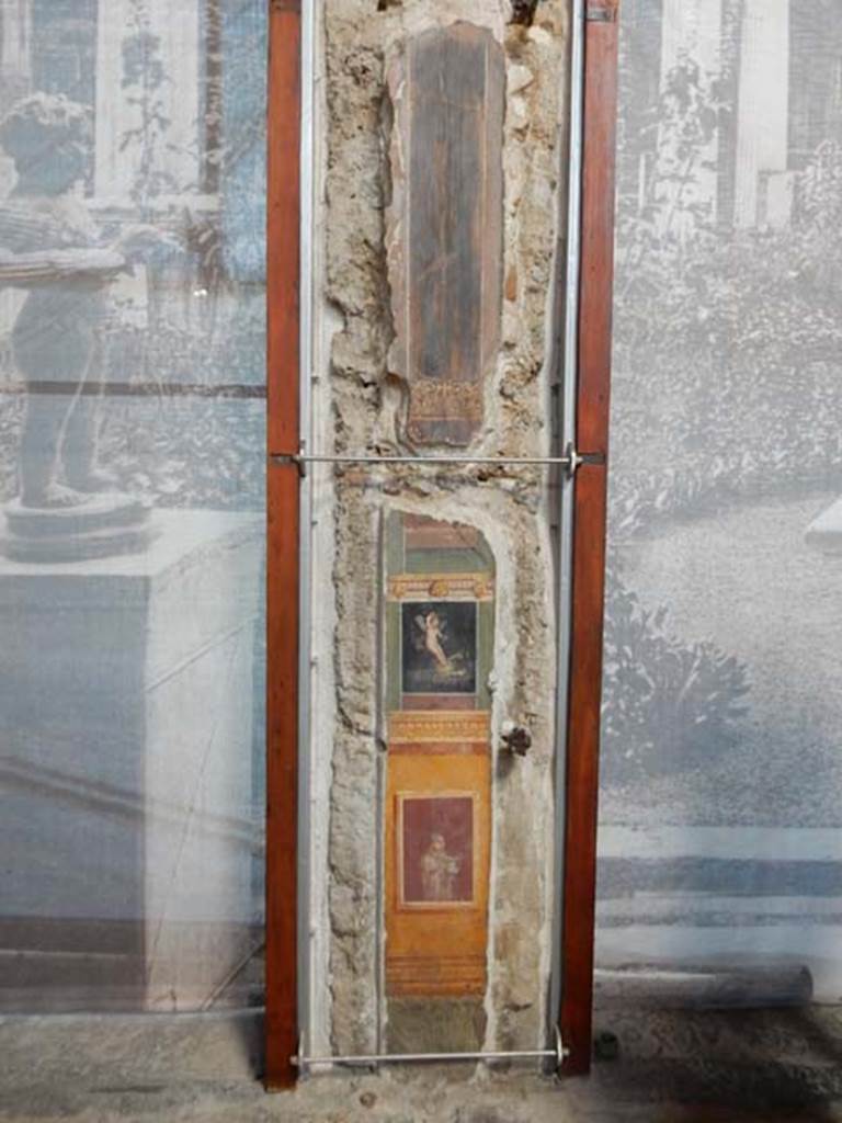 VI.15.1 Pompeii. May 2017. 
Painted panel on south end of west wall of atrium, leading onto peristyle. Photo courtesy of Buzz Ferebee.

