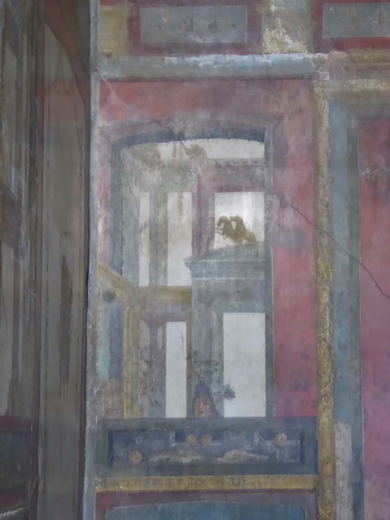 VI.15.1 Pompeii. December 2006. South wall of exedra with wall painting of naval scene, with basket and mask above.