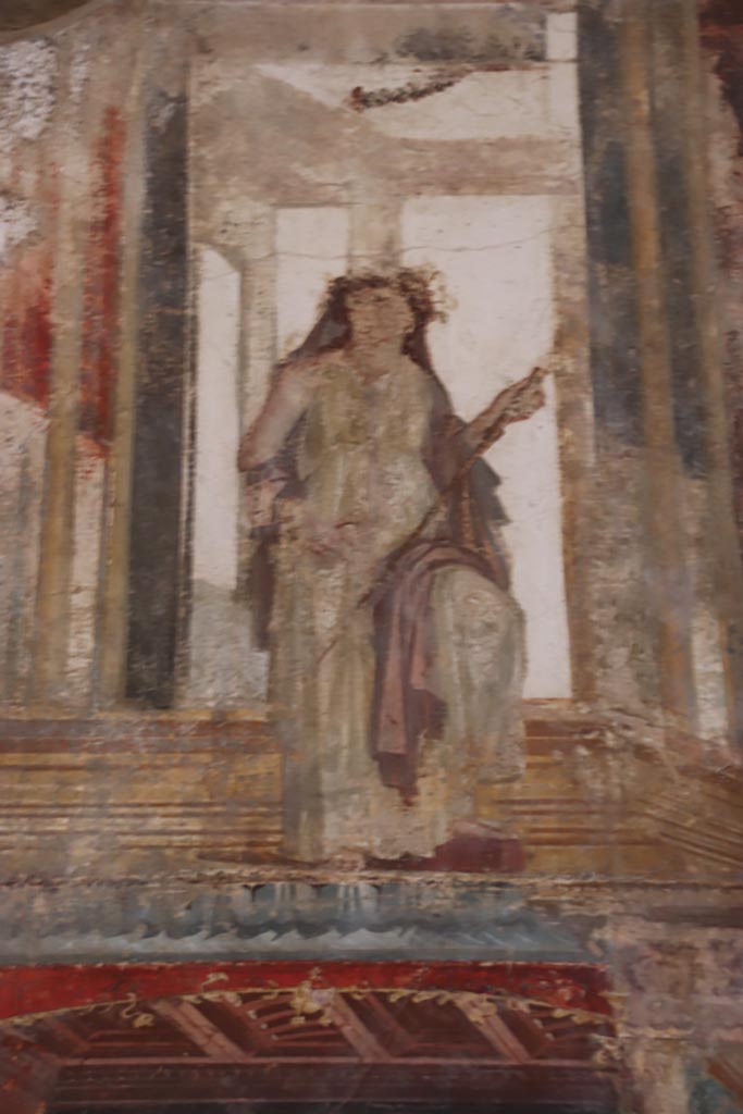 VI.15.1 Pompeii. October 2023. 
Upper south wall, detail of painted figure, continuation from south-east corner.
Photo courtesy of Klaus Heese.
