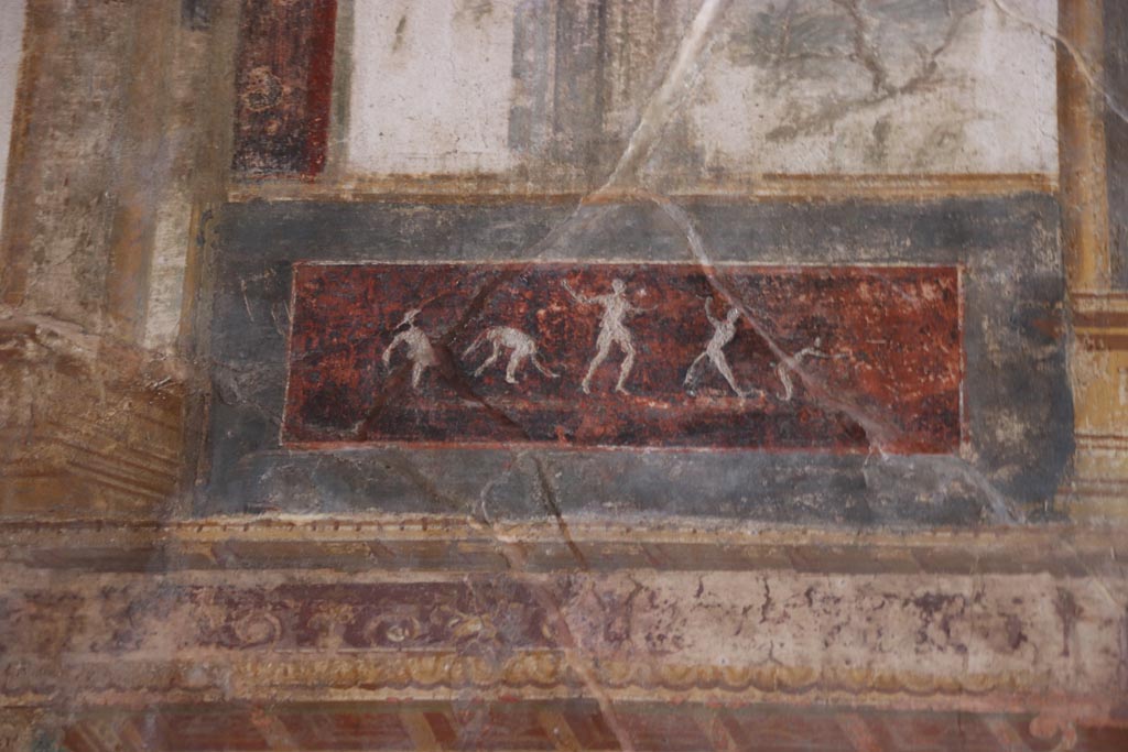 VI.15.1 Pompeii. October 2023. Upper south wall, detail of painted panel on east side of central figure. Photo courtesy of Klaus Heese.