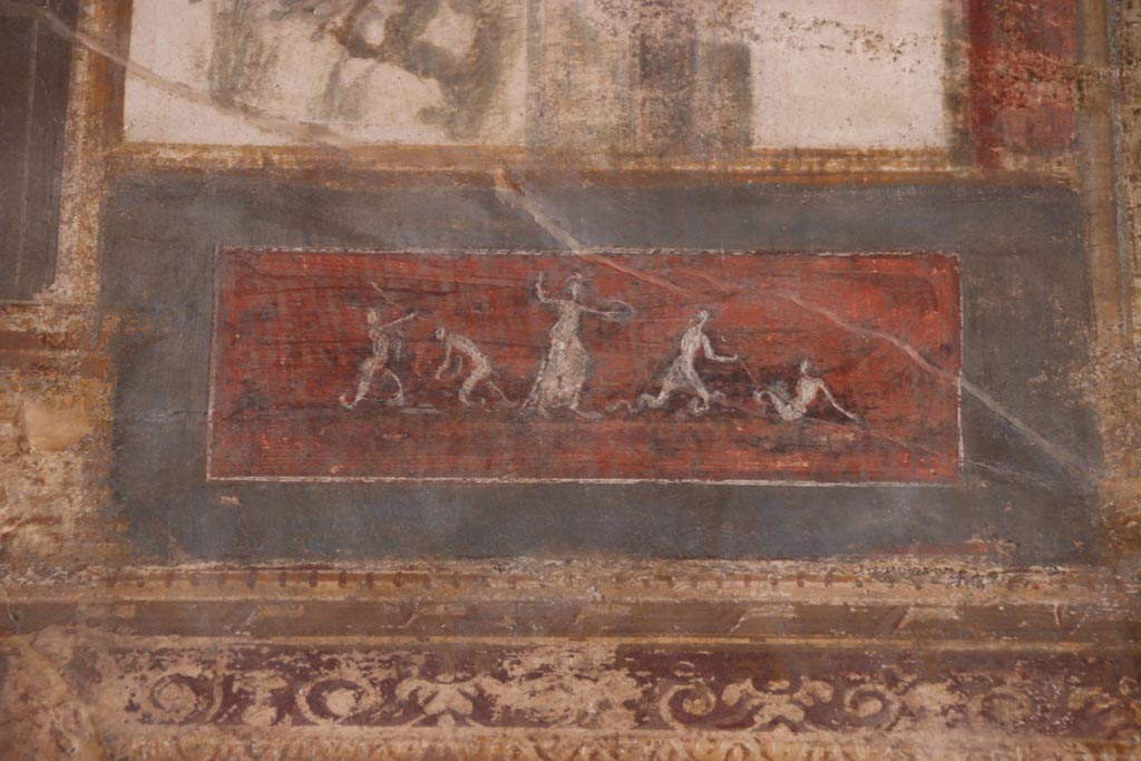 VI.15.1 Pompeii. October 2023. Upper south wall, detail of painted panel towards west end. Photo courtesy of Klaus Heese.