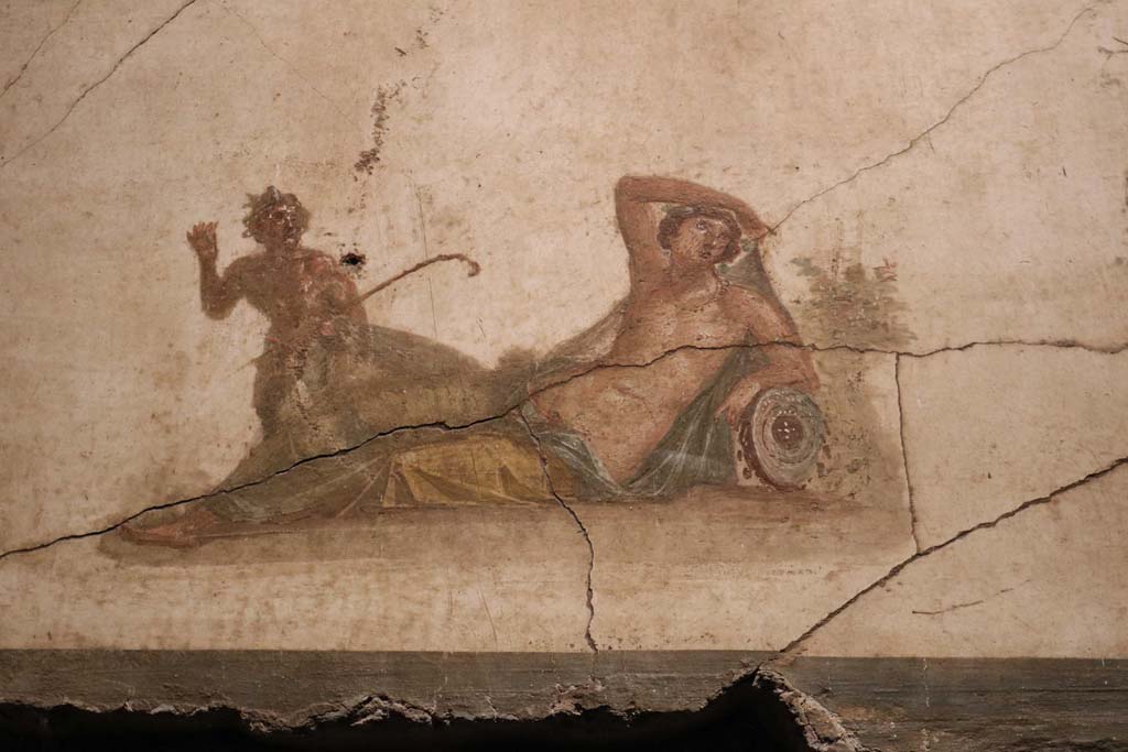 VI.15.1 Pompeii. December 2018. 
Detail of panel showing Pan discovering Hermaphrodite from above door in south wall. Photo courtesy of Aude Durand.
