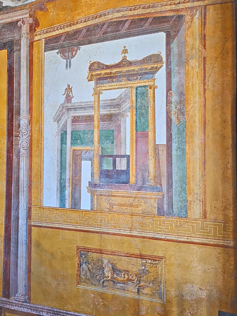 VI.15.1 Pompeii. April 2023. 
Architectural wall painting on south wall in south-west corner of exedra. Photo courtesy of Giuseppe Ciaramella.

