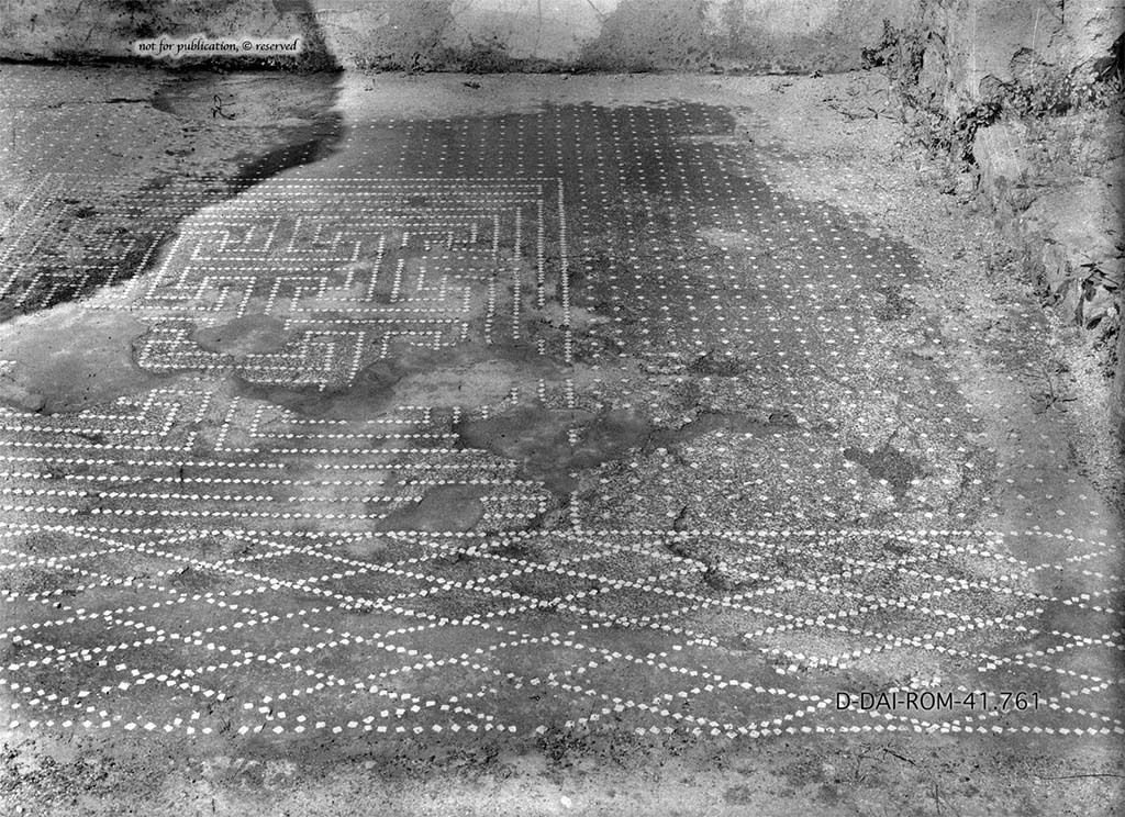 VI.15.5 Pompeii. Room 25, flooring in ala.
DAIR 41.761. Photo © Deutsches Archäologisches Institut, Abteilung Rom, Arkiv. 
See Pernice, E.  1938. Pavimente und Figürliche Mosaiken: Die Hellenistische Kunst in Pompeji, Band VI. Berlin: de Gruyter, p. 102, Taf. 46,6.
According to PPM –
“The flooring was of cocciopesto with a decoration of white stones.
The threshold towards the atrium showed a net of diamond shapes.
In the centre of the floor dotted with white stones was the carpet with mesh of meanders and squares. 
See Carratelli, G. P., 1990-2003. Pompei: Pitture e Mosaici. Vol. V. Roma: Istituto della enciclopedia italiana, (p.587, nos.13 and 14).
